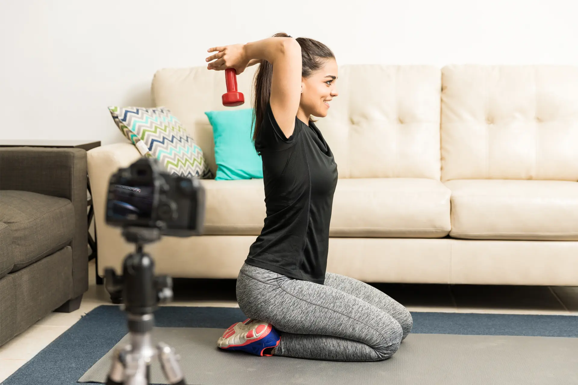 Woman performing a full body toning workout to build lean muscle, improve strength and enhance overall fitness