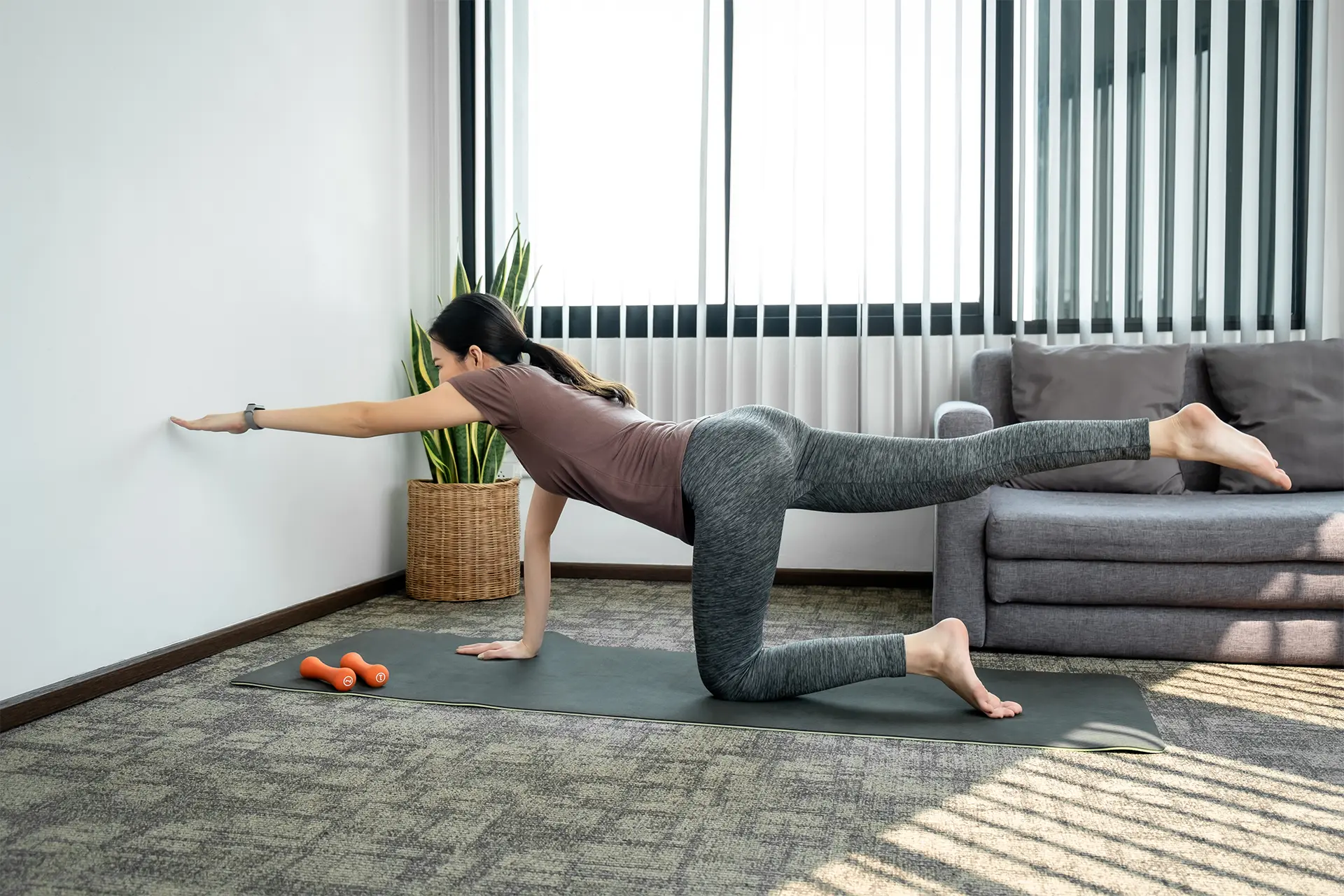 Woman performing exercises to improve balance, core strength, stability and overall fitness